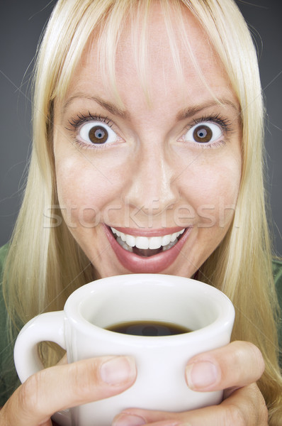 Beautiful Woman Enjoys Coffee Stock photo © feverpitch