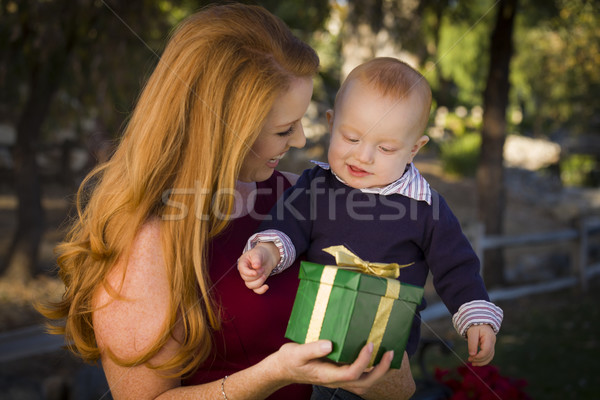 Stock photo: Beautiful Young Mother and Baby with Christmas Gift