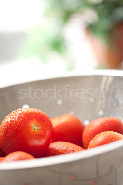 Fresh, Vibrant Roma Tomatoes in Colander with Water Drops Stock photo © feverpitch