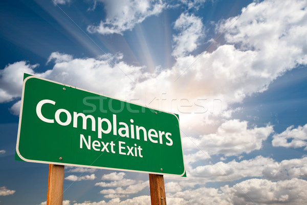 Complainers Green Road Sign and Clouds Stock photo © feverpitch