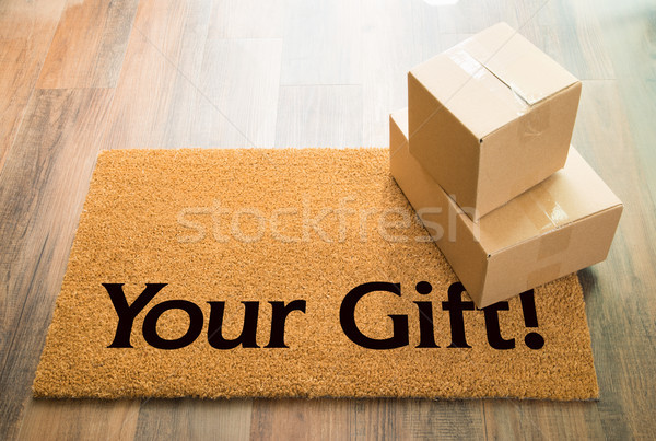 Your Gift Welcome Mat On Wood Floor With Shipment of Boxes Stock photo © feverpitch