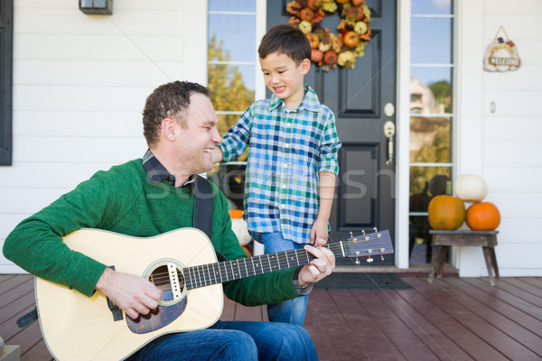 Young Mixed Race Chinese and Caucasian Son Singing Songs and Pla Stock photo © feverpitch