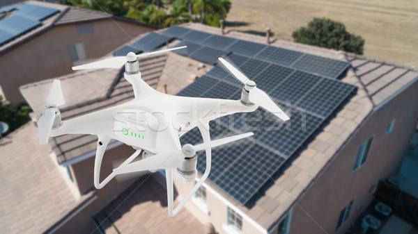 Stock photo: UAV Drone Inspecting Solar Panels On Large House
