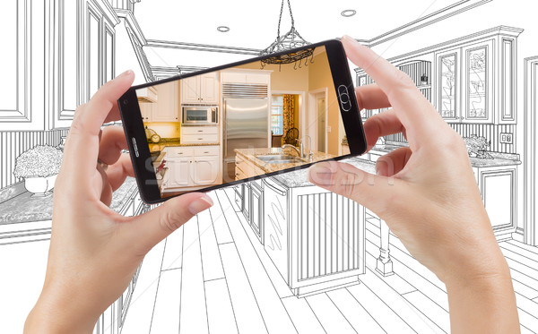 Hands Holding Smart Phone Displaying Photo of Kitchen Drawing Be Stock photo © feverpitch