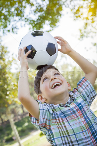 Aranyos fiatal srác játszik futballabda park kint Stock fotó © feverpitch