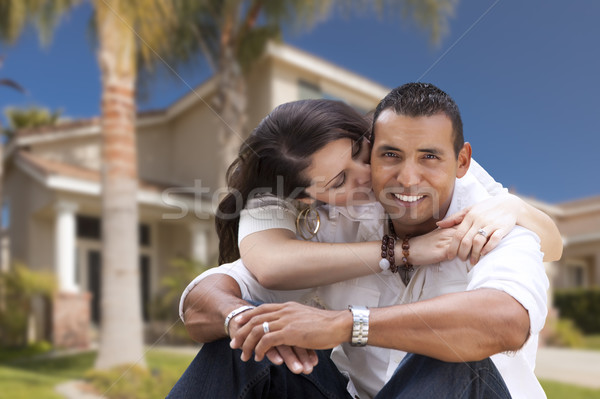Happy Hispanic Young Couple in Front of Their New Home Stock photo © feverpitch