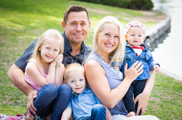 Happy Young Caucasian Family Portrait In The Park Stock photo © feverpitch
