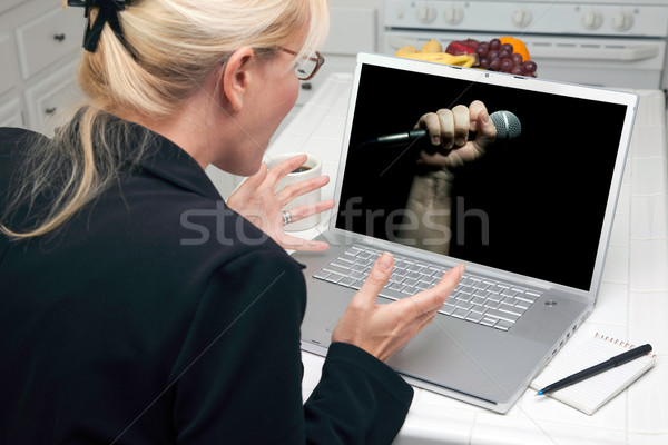 Excited Woman In Kitchen Using Laptop - Freedom of Speech Stock photo © feverpitch