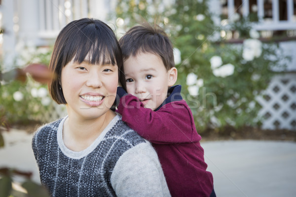 Chinese Mother Having Fun with Her Mixed Race Baby Son Stock photo © feverpitch