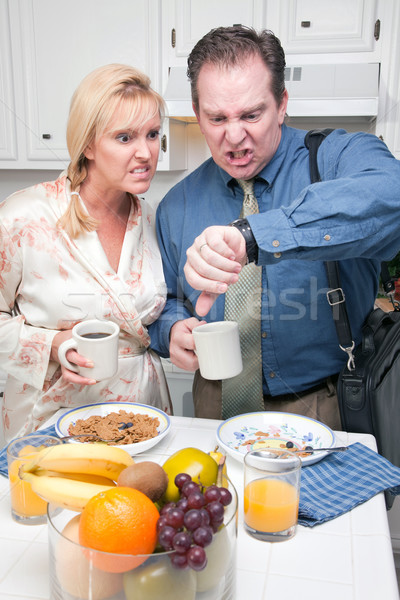 Stressed Couple in Kitchen Late for Work Stock photo © feverpitch