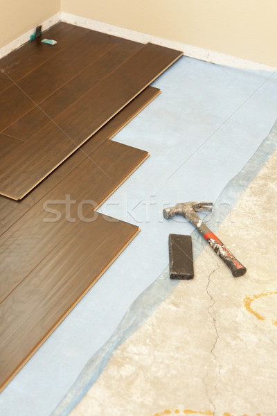 Hammer and Block with New Laminate Flooring Stock photo © feverpitch
