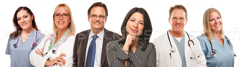 Stock photo: Hispanic Woman and Man with Doctors or Nurses Behind