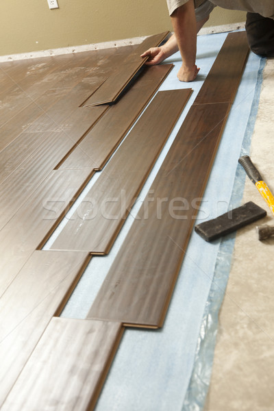 Mann Installation neue Holz Bodenbelag abstrakten Stock foto © feverpitch