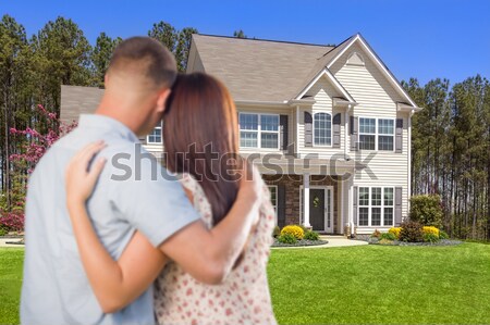 Happy Hispanic Young Couple in Front of Their New Home Stock photo © feverpitch