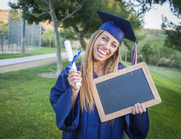 Nő tart diploma üres tábla visel sapka Stock fotó © feverpitch