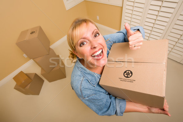 Stock photo: Happy Thumbs Up Woman Moving Boxes