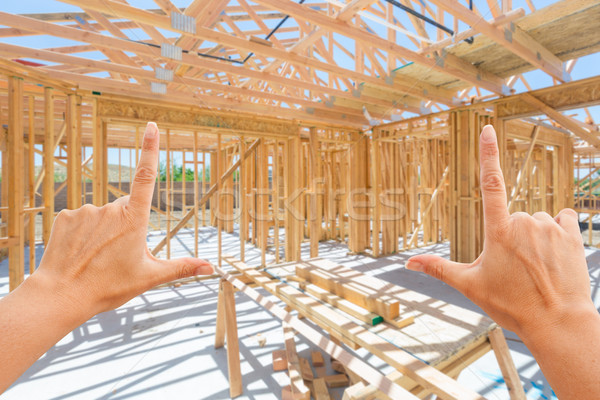 Hands Framing Inside New Home Construction Framing. Stock photo © feverpitch