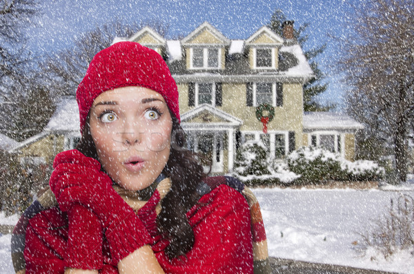 Smiling Mixed Race Woman in Winter Clothing Outside in Snow Stock photo © feverpitch
