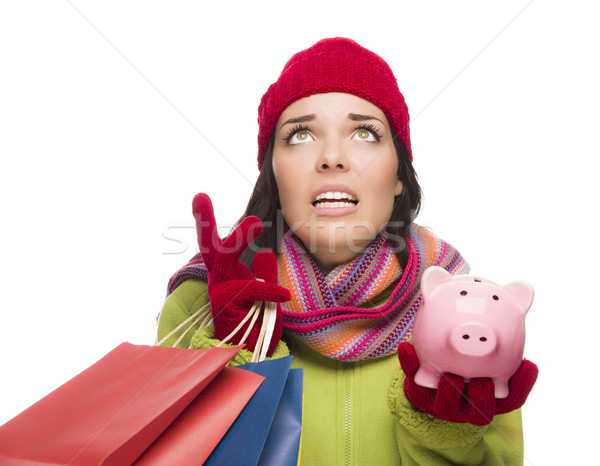 Stressed Mixed Race Woman Holding Shopping Bags and Piggybank Stock photo © feverpitch