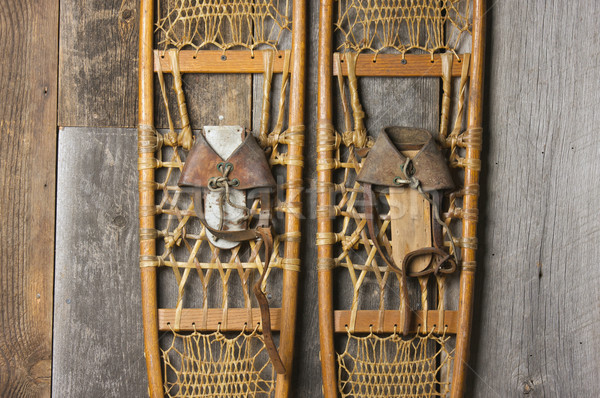 Antique Snowshoes on Rustic Cabin Wall Stock photo © feverpitch