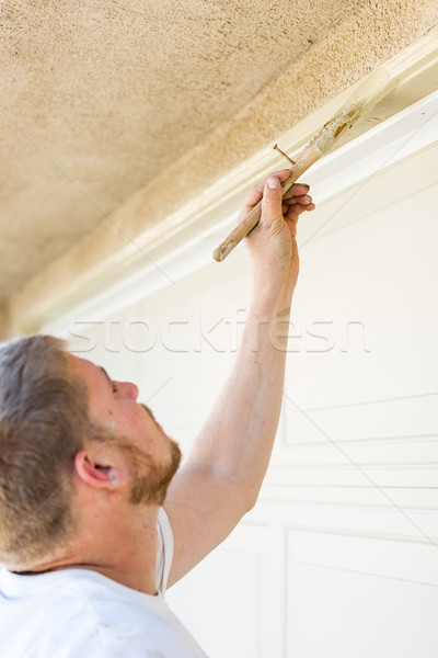 Professional Painter Cutting In With Brush to Paint Garage Door  Stock photo © feverpitch