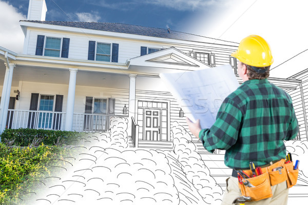 Stock photo: Male Contractor with Hard Hat and Tool Belt Looking At Custom Ho