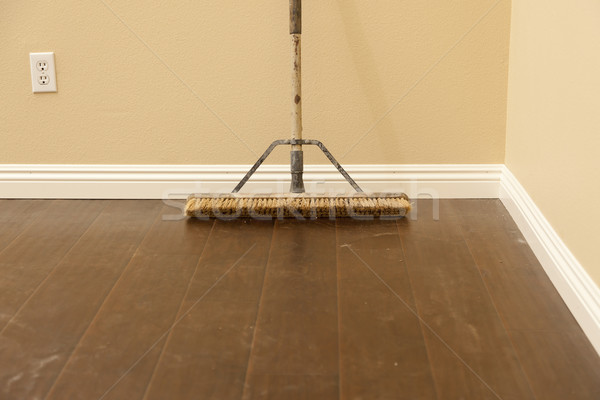 Push Broom on a Newly Installed Laminate Floor and Baseboard Stock photo © feverpitch