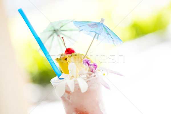 Fruity Tropical Drink with Pineapple and Umbrullas Stock photo © feverpitch