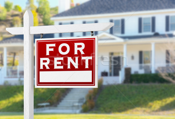 Right Facing For Rent Real Estate Sign In Front of House. Stock photo © feverpitch