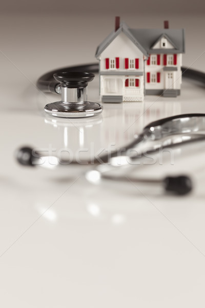 Stethoscope with Small Model Home Stock photo © feverpitch