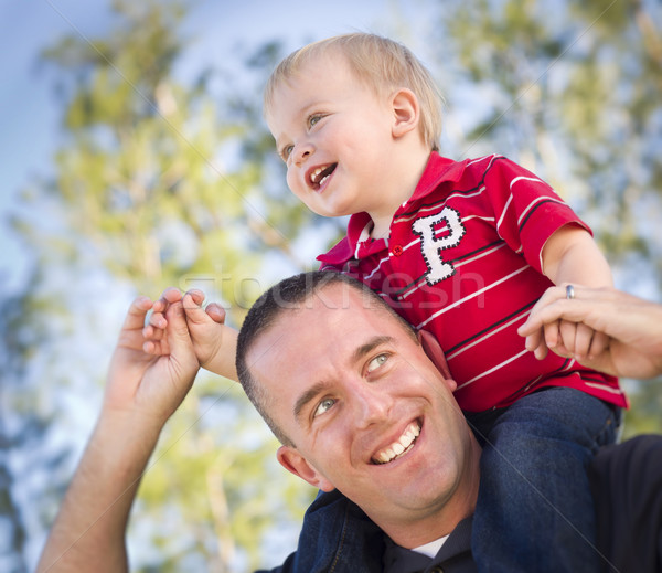 Stock photo: Young Laughing Father and Child Piggy Back