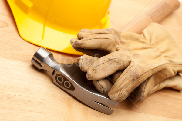 Stock photo: Yellow Hard Hat, Gloves and Hammer on Wood