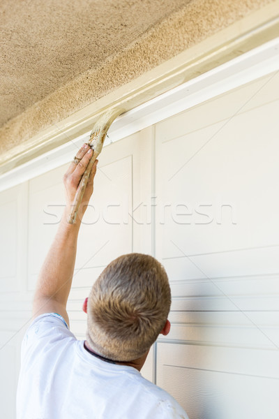 Professional Painter Cutting In With Brush to Paint Garage Door  Stock photo © feverpitch