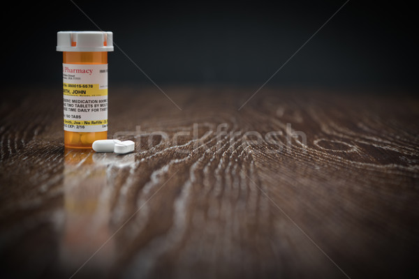 Non-Proprietary Prescription Medicine Bottle and Pills on Reflec Stock photo © feverpitch