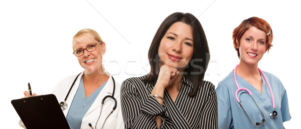 Hispanic Woman with Female Doctors and Nurses Stock photo © feverpitch
