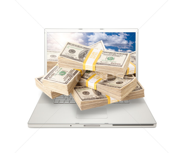 Laptop with Stacks of Money Coming From Screen Stock photo © feverpitch