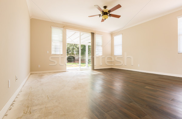 Room with Gradation from Cement to Hardwood Flooring Stock photo © feverpitch