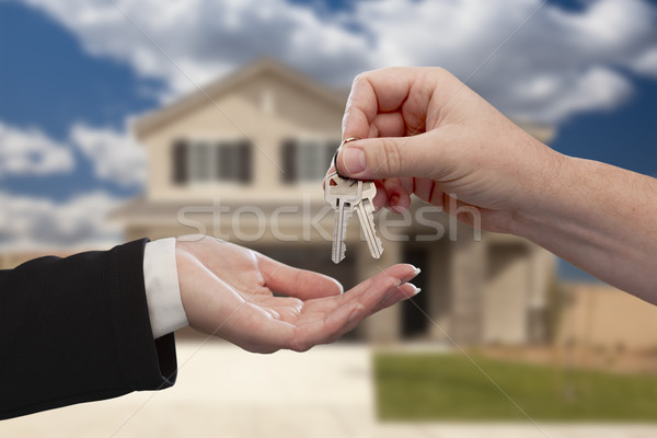 Stock photo: Handing Over the House Keys in Front of New Home