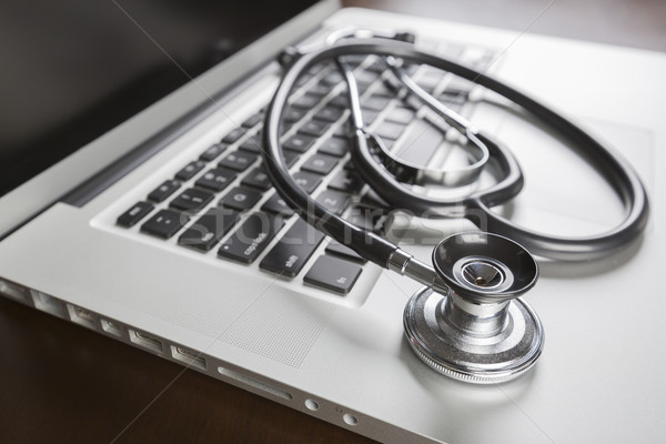 Medical Stethoscope Resting on Laptop Computer Stock photo © feverpitch