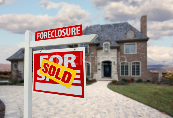 Stock photo: Sold Foreclosure Home For Sale Sign and House