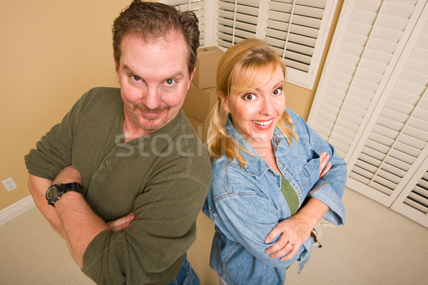 Goofy Couple and Moving Boxes in Empty Room Stock photo © feverpitch