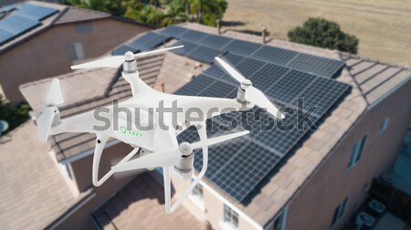 UAV Drone Inspecting Solar Panels On Large House Stock photo © feverpitch