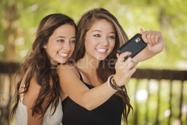 Attractive Mixed Race Girlfriends Taking Self Portrait with Came Stock photo © feverpitch