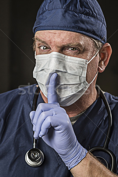 Secretive Doctor Wearing Protective Head Wear Stock photo © feverpitch