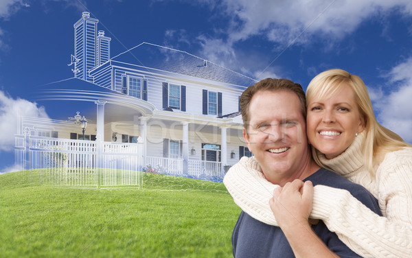 Hugging Couple with Ghosted House Drawing Behind Stock photo © feverpitch