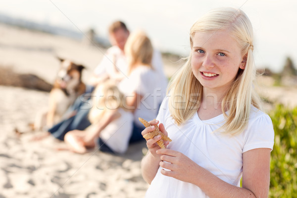Adorable Little Blonde Girl with Starfish Stock photo © feverpitch