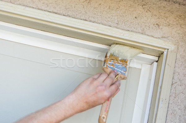 Professional Painter Cutting In With Brush to Paint Garage Door  Stock photo © feverpitch