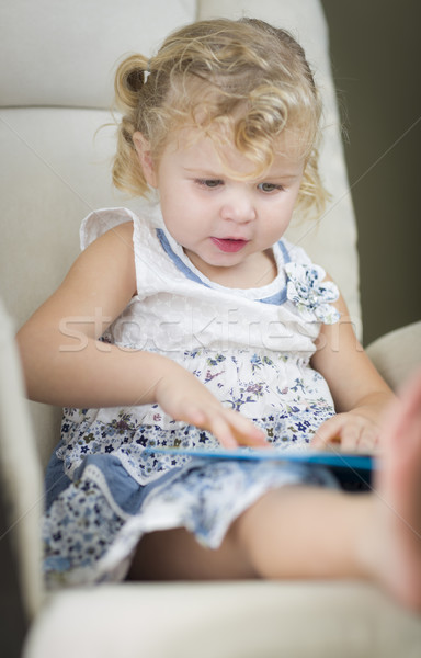 Blonde Haired Blue Eyed Little Girl Reading Her Book Stock photo © feverpitch