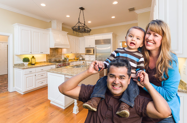 Young Mixed Race Family Having Fun in Custom Kitchen Stock photo © feverpitch