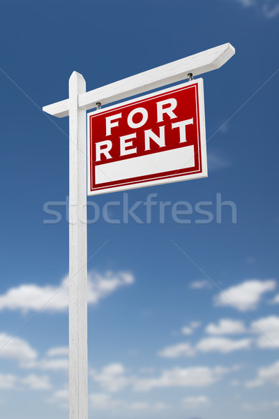 Right Facing For Rent Real Estate Sign on a Blue Sky with Clouds Stock photo © feverpitch